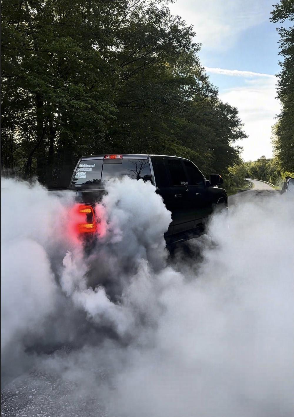 Ram 2500 rolling smoke on a back road